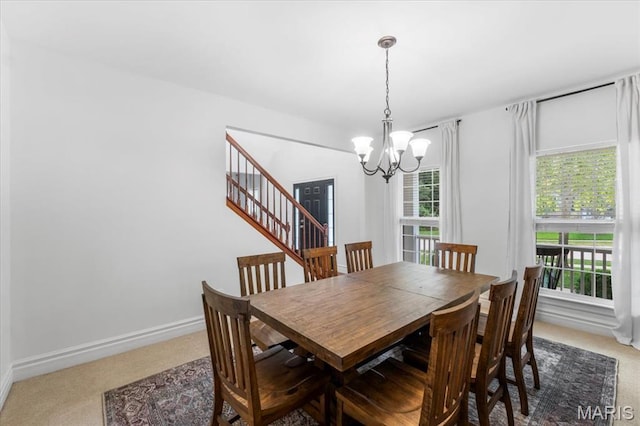 1412 Heritage Valley Dr, High Ridge, MO 63049 - dining space with light colored carpet, a chandelier, and healthy amount of natural light