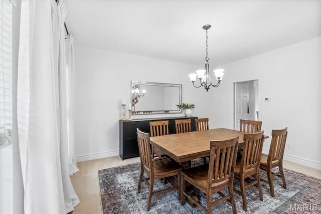 1412 Heritage Valley Dr, High Ridge, MO 63049 - dining room featuring a chandelier and baseboards