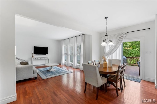 1412 Heritage Valley Dr, High Ridge, MO 63049 - dining space featuring wood finished floors and baseboards
