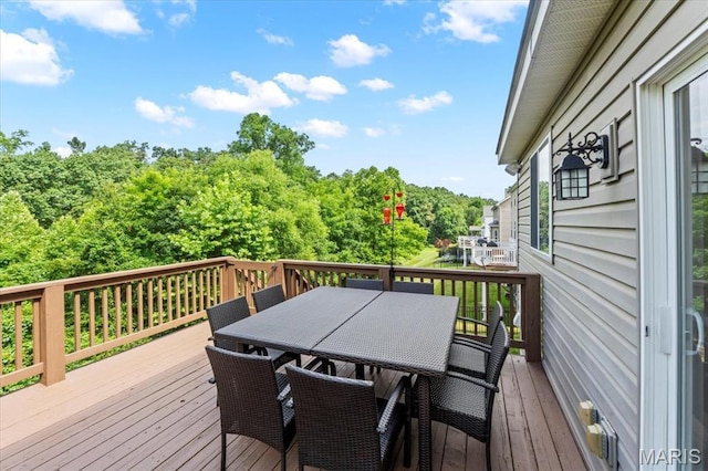 1412 Heritage Valley Dr, High Ridge, MO 63049 - wooden deck with outdoor dining space and view of scattered trees