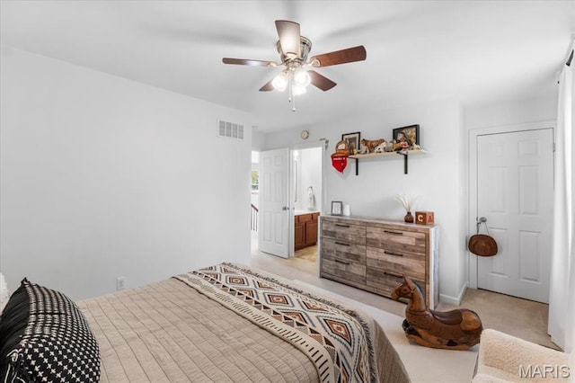 1412 Heritage Valley Dr, High Ridge, MO 63049 - bedroom featuring light colored carpet, a ceiling fan, and ensuite bath