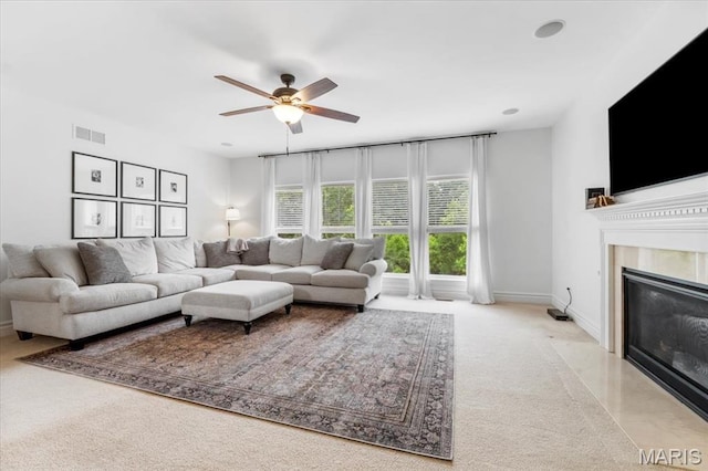 1412 Heritage Valley Dr, High Ridge, MO 63049 - carpeted living area with ceiling fan and a fireplace