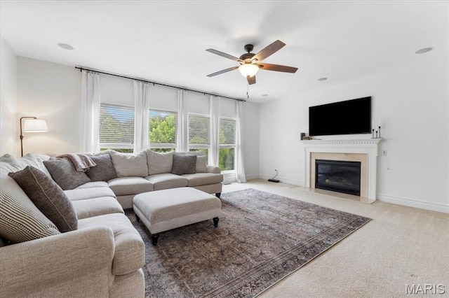 1412 Heritage Valley Dr, High Ridge, MO 63049 - living room featuring a ceiling fan, carpet flooring, and a fireplace with flush hearth