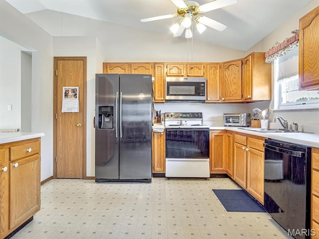 1 Wild Horse Ct, Troy, IL 62294 - kitchen with appliances with stainless steel finishes, lofted ceiling, light countertops, light floors, and a ceiling fan