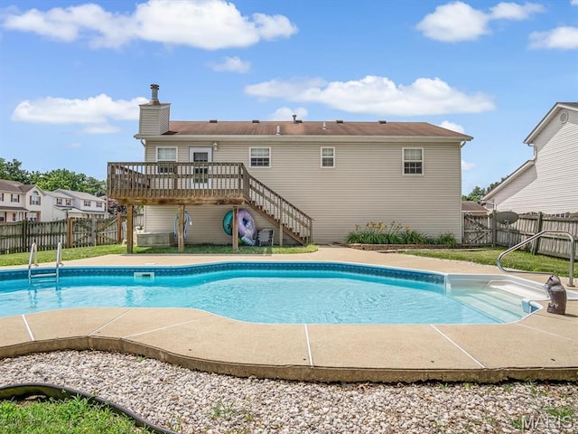 1 Wild Horse Ct, Troy, IL 62294 - view of swimming pool featuring stairway, a wooden deck, and a fenced backyard