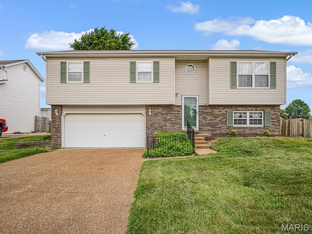 1 Wild Horse Ct, Troy, IL 62294 - bi-level home with brick siding, concrete driveway, and an attached garage