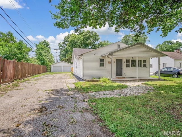 628 E Chain Of Rocks Rd, Granite City, IL 62040 - view of front of house featuring a garage and an outdoor structure