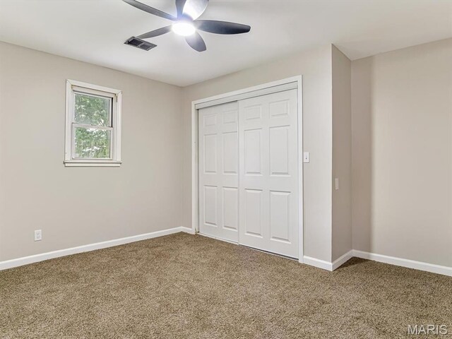 628 E Chain Of Rocks Rd, Granite City, IL 62040 - unfurnished bedroom with carpet, a closet, and ceiling fan