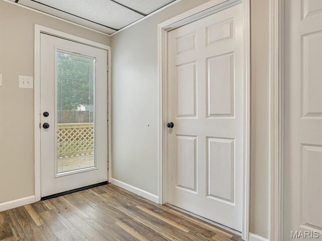 628 E Chain Of Rocks Rd, Granite City, IL 62040 - doorway to outside featuring wood finished floors and baseboards