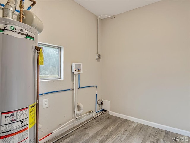 628 E Chain Of Rocks Rd, Granite City, IL 62040 - laundry room with gas water heater, electric dryer hookup, washer hookup, wood finished floors, and gas dryer hookup