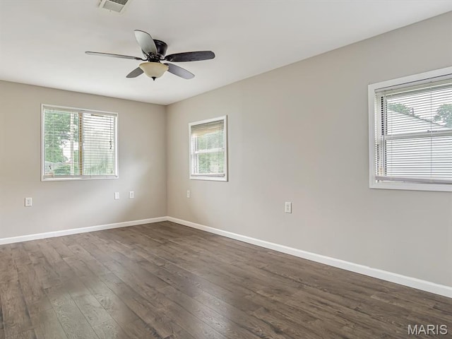 628 E Chain Of Rocks Rd, Granite City, IL 62040 - spare room with plenty of natural light, dark wood-style floors, and ceiling fan