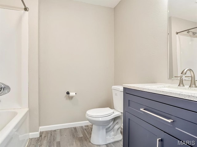 628 E Chain Of Rocks Rd, Granite City, IL 62040 - full bathroom featuring wood finished floors, vanity, and shower / tub combination