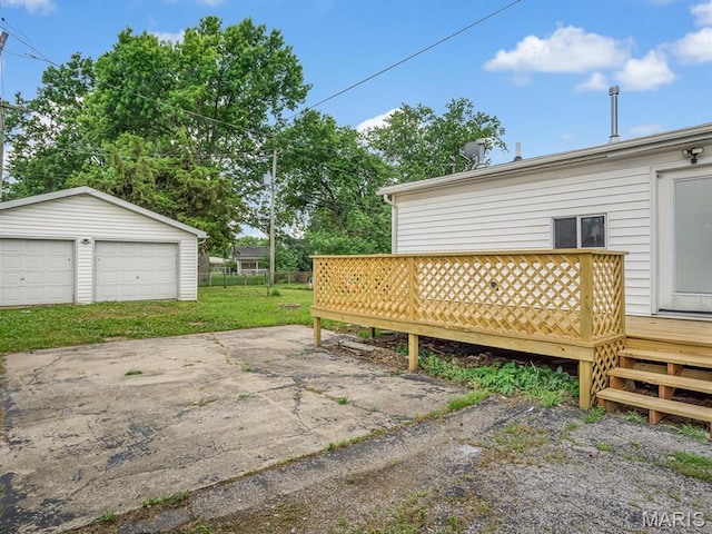 628 E Chain Of Rocks Rd, Granite City, IL 62040 - deck featuring a garage and an outbuilding
