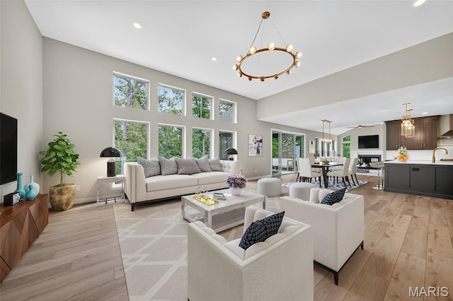 212 Terradel Trl, Foristell, MO 63348 - living room with a chandelier, light wood-style floors, and recessed lighting