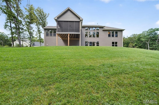 212 Terradel Trl, Foristell, MO 63348 - rear view of house with a sunroom and a lawn