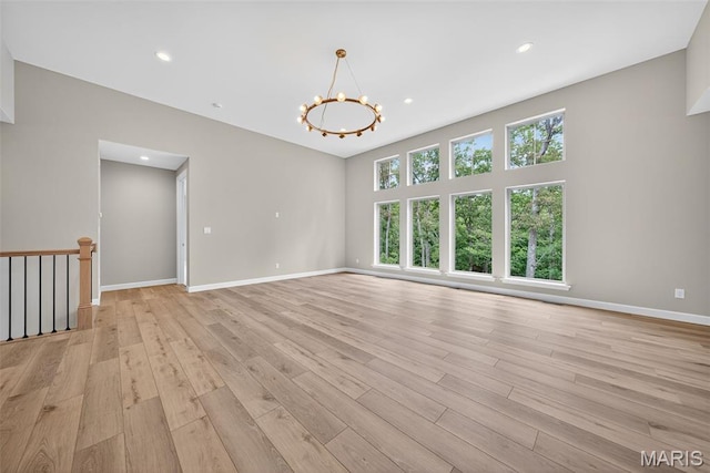 212 Terradel Trl, Foristell, MO 63348 - spare room featuring light wood-style flooring, a chandelier, and recessed lighting