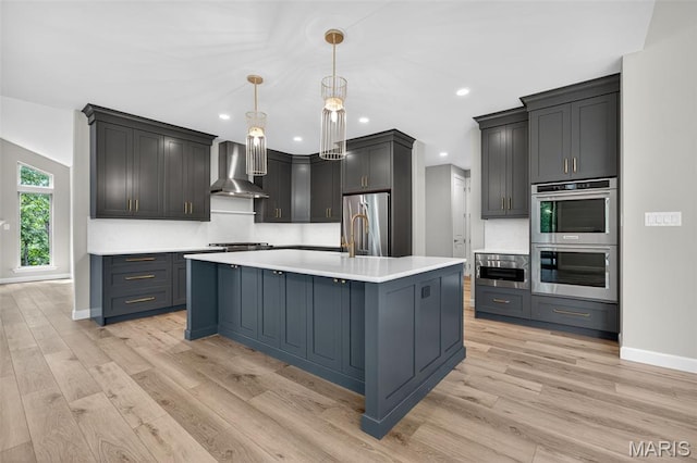 212 Terradel Trl, Foristell, MO 63348 - kitchen featuring wall chimney exhaust hood, appliances with stainless steel finishes, light wood-style flooring, light countertops, and recessed lighting