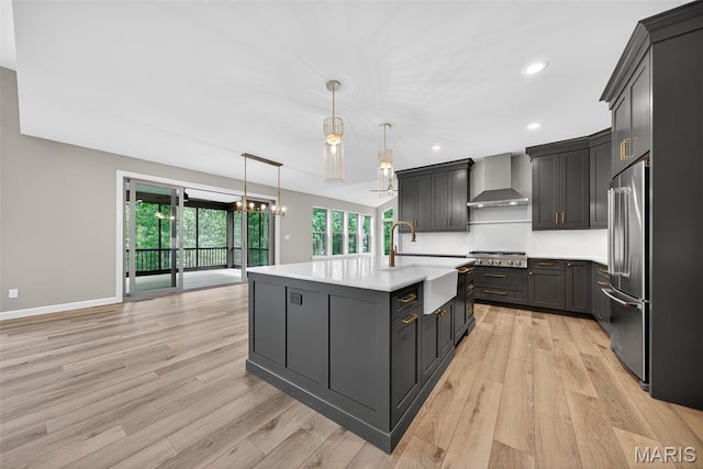 212 Terradel Trl, Foristell, MO 63348 - kitchen with wall chimney range hood, stainless steel appliances, healthy amount of natural light, light countertops, and recessed lighting