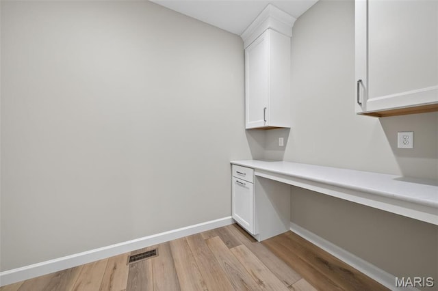 212 Terradel Trl, Foristell, MO 63348 - bar with built in desk and light wood finished floors