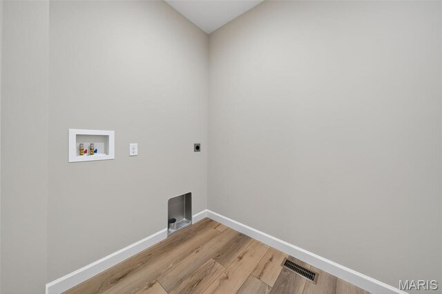 212 Terradel Trl, Foristell, MO 63348 - laundry room featuring hookup for an electric dryer, washer hookup, and light wood-style flooring
