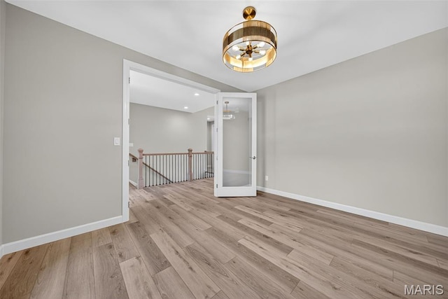 212 Terradel Trl, Foristell, MO 63348 - empty room with a chandelier and light wood-style flooring