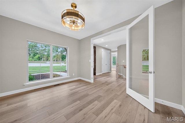 212 Terradel Trl, Foristell, MO 63348 - spare room with light wood-style flooring and a chandelier