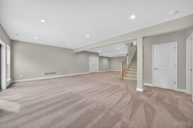 212 Terradel Trl, Foristell, MO 63348 - finished below grade area with light carpet, stairway, and recessed lighting