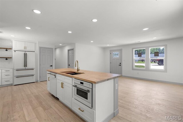715 Westchester Ct, Kirkwood, MO 63122 - kitchen featuring white appliances, butcher block counters, white cabinetry, light wood-type flooring, and recessed lighting