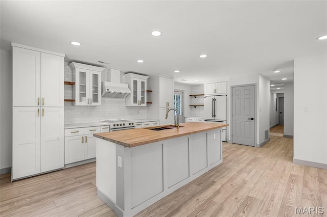 715 Westchester Ct, Kirkwood, MO 63122 - kitchen featuring wood counters, open shelves, custom exhaust hood, white appliances, and an island with sink