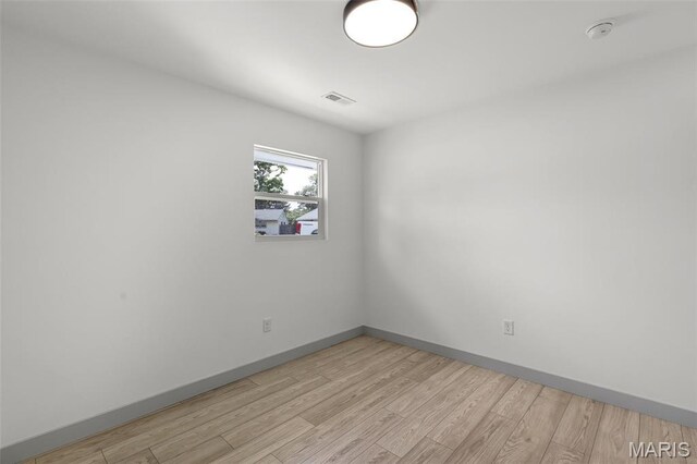 715 Westchester Ct, Kirkwood, MO 63122 - unfurnished room with a smoke detector and light wood-style flooring