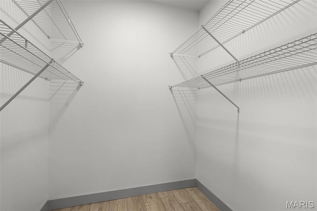 715 Westchester Ct, Kirkwood, MO 63122 - spacious closet featuring wood finished floors