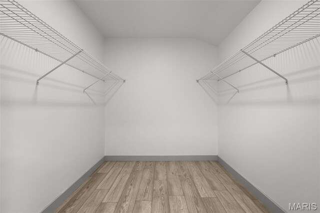 715 Westchester Ct, Kirkwood, MO 63122 - walk in closet featuring wood finished floors