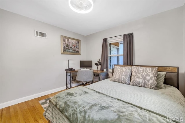 1164 Ursula Ave, University City, MO 63130 - bedroom featuring baseboards and wood finished floors