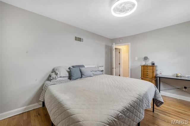 1164 Ursula Ave, University City, MO 63130 - bedroom with baseboards and wood finished floors