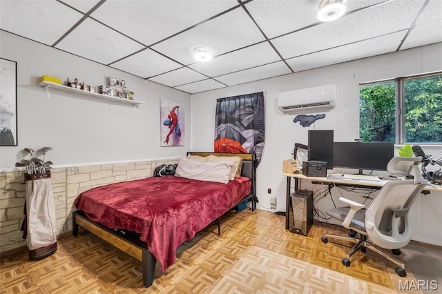 1164 Ursula Ave, University City, MO 63130 - bedroom with a wall mounted air conditioner, a paneled ceiling, and a desk