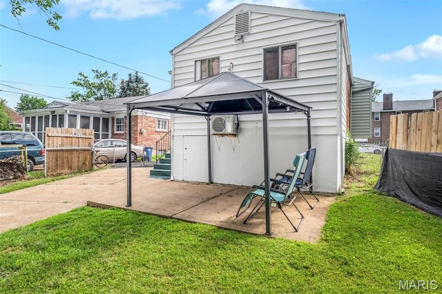 1164 Ursula Ave, University City, MO 63130 - back of house featuring a gazebo, a patio area, and a wall mounted air conditioner
