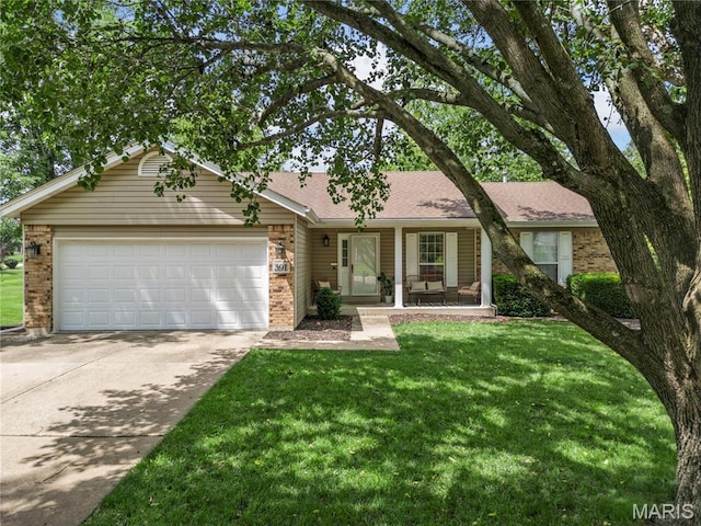 391 Carriage Trail Ct, Ofallon, MO 63368 - single story home with brick siding, a garage, concrete driveway, and a front yard