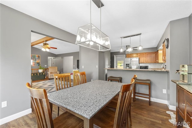 391 Carriage Trail Ct, Ofallon, MO 63368 - dining room with ceiling fan, dark wood-style flooring, and lofted ceiling