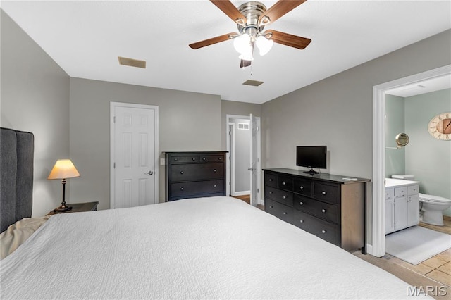 391 Carriage Trail Ct, Ofallon, MO 63368 - bedroom with connected bathroom, ceiling fan, and tile patterned floors