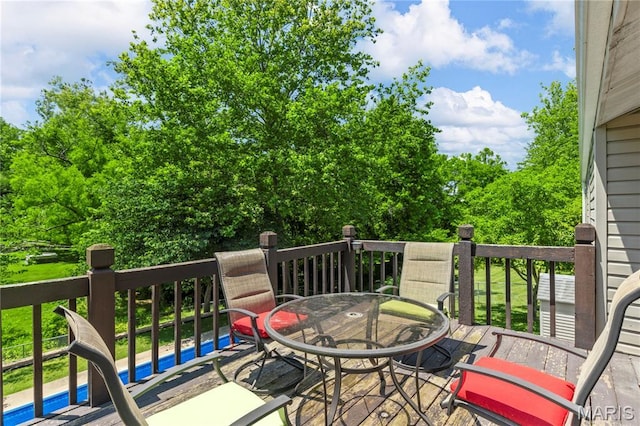 391 Carriage Trail Ct, Ofallon, MO 63368 - wooden terrace with outdoor dining space