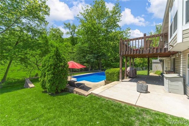 391 Carriage Trail Ct, Ofallon, MO 63368 - outdoor pool featuring a patio, a lawn, and a wooden deck