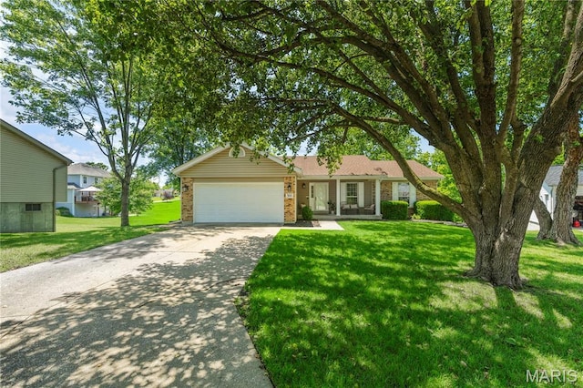 391 Carriage Trail Ct, Ofallon, MO 63368 - ranch-style house featuring an attached garage, concrete driveway, a front yard, and brick siding