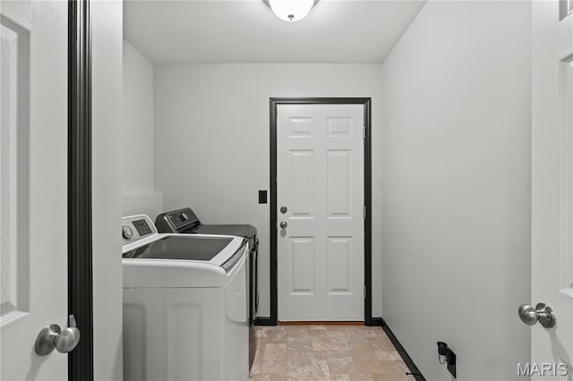 111 Rivers Edge Dr, Moscow Mills, MO 63362 - washroom featuring independent washer and dryer and stone finish flooring