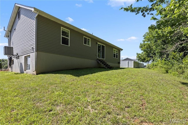111 Rivers Edge Dr, Moscow Mills, MO 63362 - rear view of property featuring a lawn and entry steps