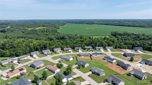 111 Rivers Edge Dr, Moscow Mills, MO 63362 - aerial perspective of suburban area with a heavily wooded area