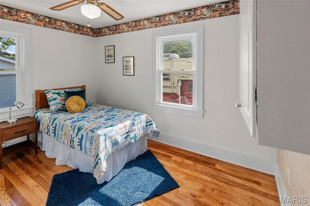 1110 Logan St, Alton, IL 62002 - bedroom with wood finished floors and ceiling fan