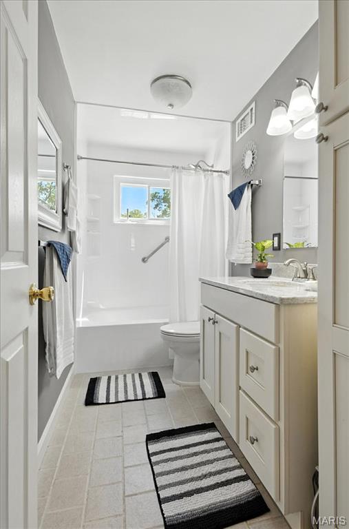 314 Weber Dr, Eureka, MO 63025 - bathroom with vanity, tile patterned floors, and shower / bath combo