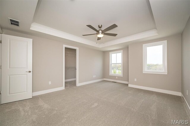 8915 E Gateway Hts Unit 94-803, Richmond Heights, MO 63144 - unfurnished bedroom with a raised ceiling, carpet, a spacious closet, and a closet
