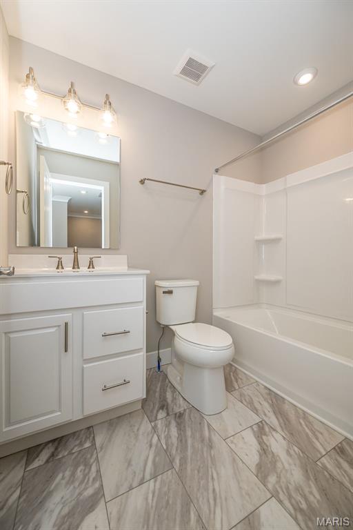 8915 E Gateway Hts Unit 94-803, Richmond Heights, MO 63144 - full bathroom featuring vanity, bathing tub / shower combination, and marble finish flooring