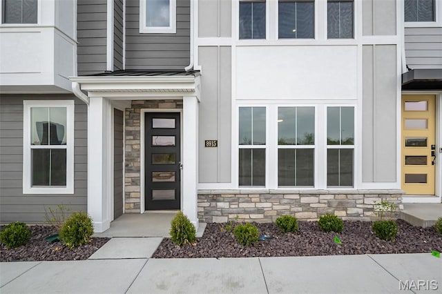 8915 E Gateway Hts Unit 94-803, Richmond Heights, MO 63144 - entrance to property featuring stone siding